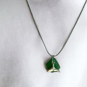 Real sea glass pendant, bright green piece with whale tail charm